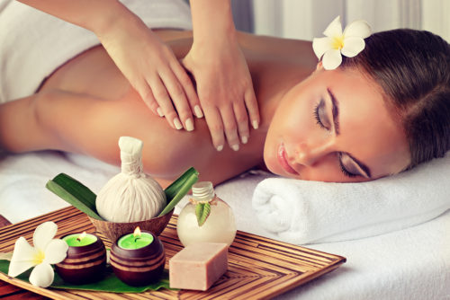Body care. Spa body massage treatment. Woman having massage in t Body care. Spa body massage treatment. Woman having massage in t